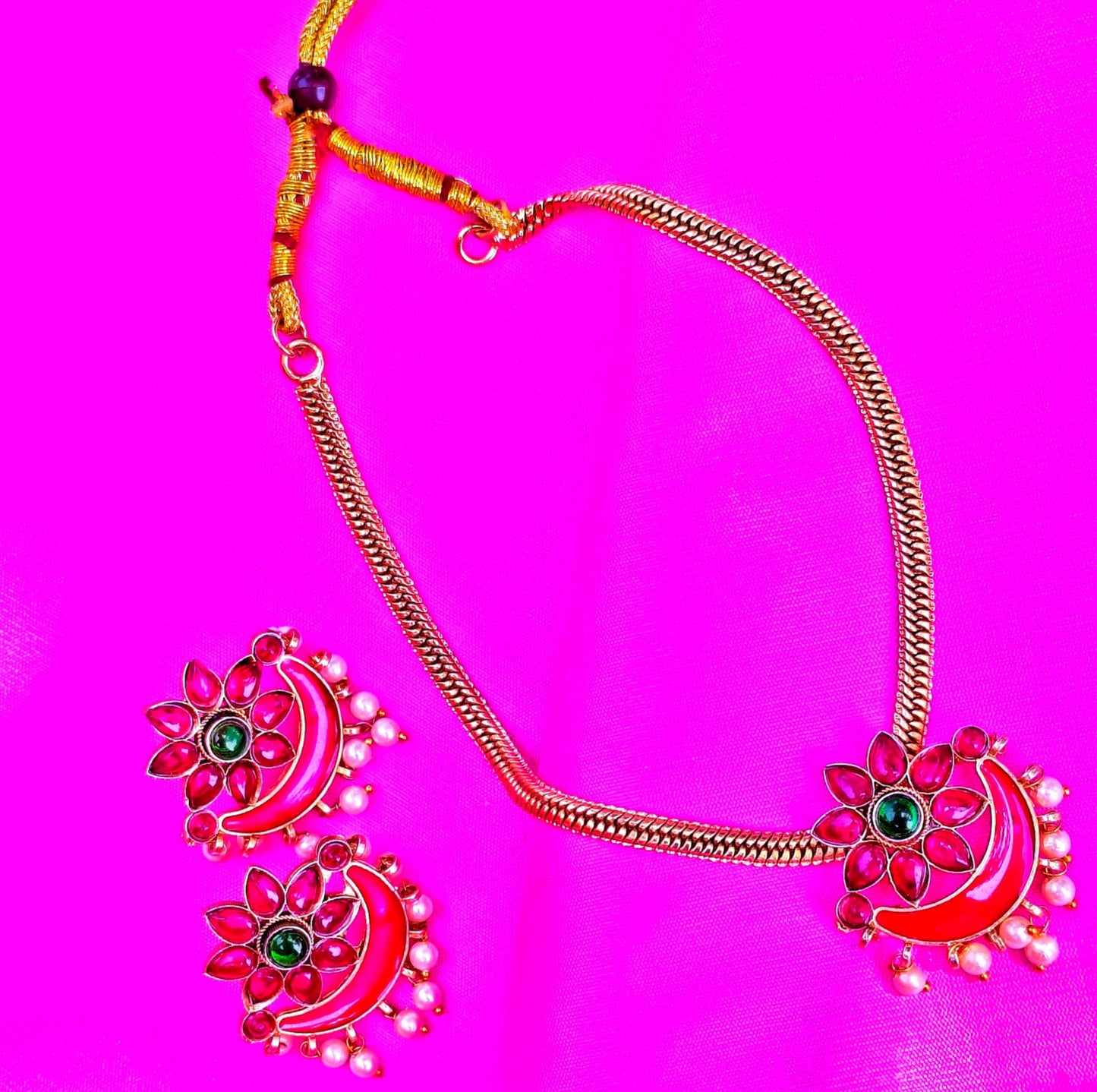Embrace the vibrant allure of Indian heritage with this stunning Temple Jewelry Set